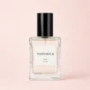 Parfumour Women's Perfume – 50ml Bottle Parfumour women's perfume in a 50ml clear glass bottle with a black cap on a soft blush-pink background