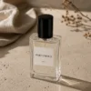 Parfumour Women's Perfume – Lifestyle Parfumour women's perfume bottle styled on a stone surface with soft natural light and warm rose tones